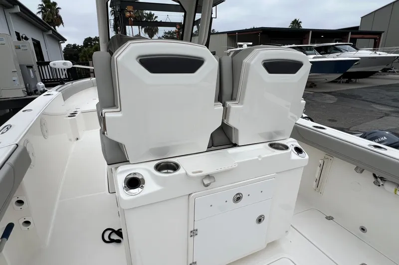 Slide: The Image of 2023 Pursuit S 268 Sport boat interior with dual seats and storage compartments. - 11