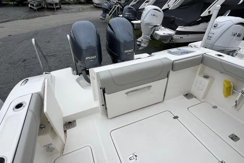 Slide: The Image of 2023 Pursuit S 268 Sport boat with twin Yamaha 200 engines, spacious deck layout. - 12