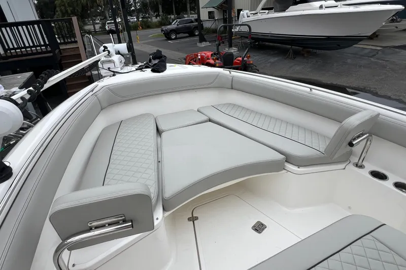 Slide: The Image of 2023 Pursuit S 268 Sport boat interior with cushioned seating and modern design. - 24