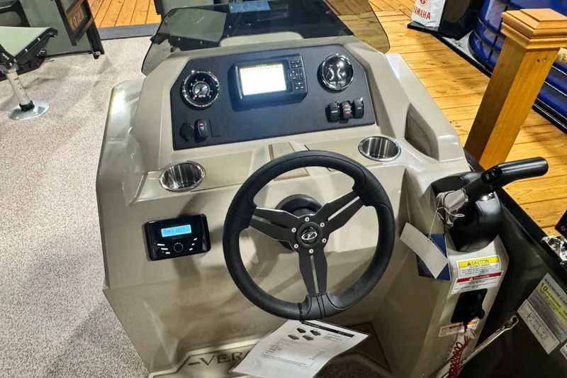Slide: The Image of 2026 Veranda Vista 20F4 boat dashboard with steering wheel and control panel. - 9