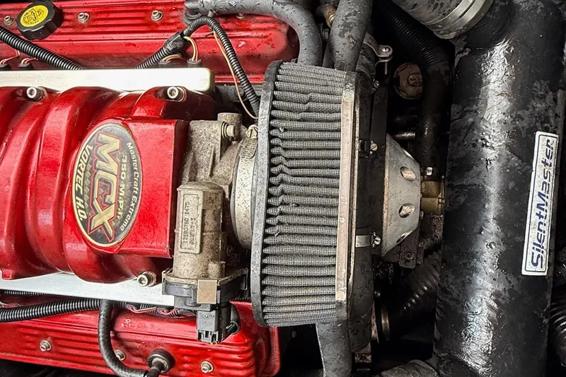 Slide: The Image of 2006 MasterCraft X45 engine close-up with MCX Vortec HO components. - 12