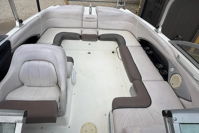 Slide: The Image of 2006 MasterCraft X45 boat interior with spacious seating and cup holders. - 17