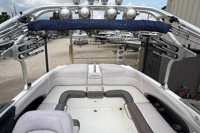 Slide: The Image of 2006 MasterCraft X45 boat interior with seating and wakeboard racks. - 18