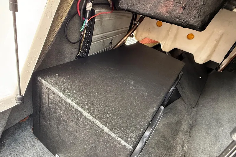 Slide: The Image of 2006 MasterCraft X45 interior compartment with wiring and storage area. - 22