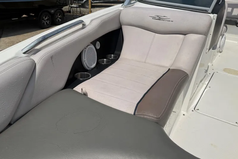 Slide: The Image of 2006 MasterCraft X45 boat interior with cushioned seating and cup holders. - 8