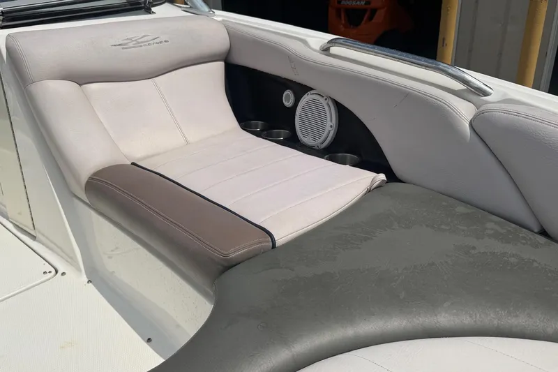 Slide: The Image of 2006 MasterCraft X45 boat interior with cushioned seating and built-in speakers. - 9