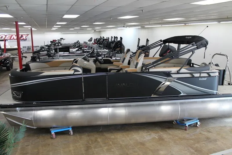 The Image of 2025 Avalon LSZ Quad Lounger 23 FT pontoon boat displayed indoors. - 1