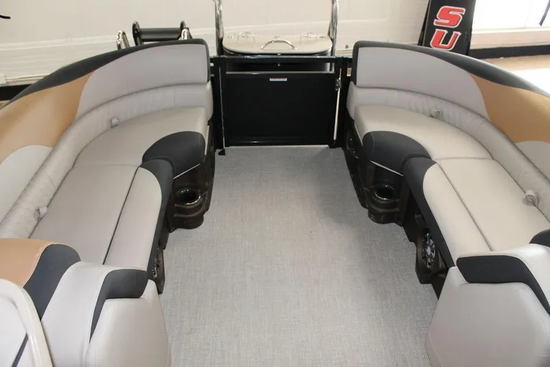 Slide: The Image of 2025 Avalon LSZ Quad Lounger 23 FT interior with plush seating and cup holders. - 10
