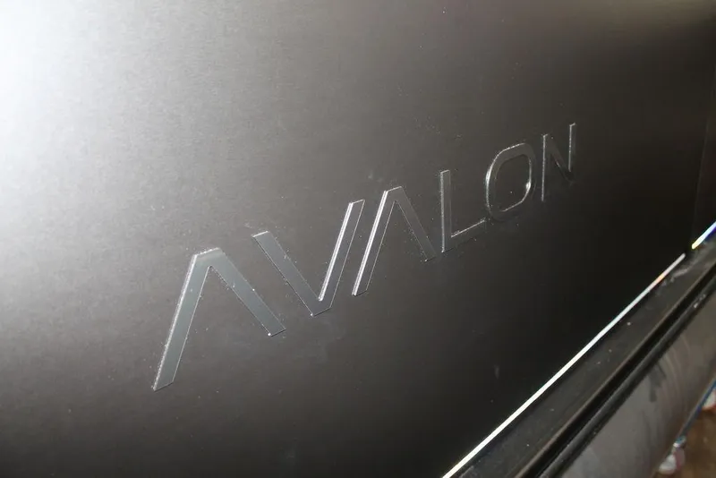 Slide: The Image of 2025 Avalon LSZ Quad Lounger 23 FT logo on sleek black surface. - 3
