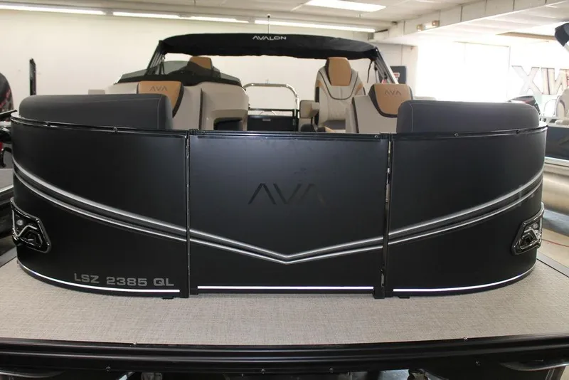 Slide: The Image of 2025 Avalon LSZ Quad Lounger 23 FT pontoon boat, sleek black design, luxurious seating. - 5