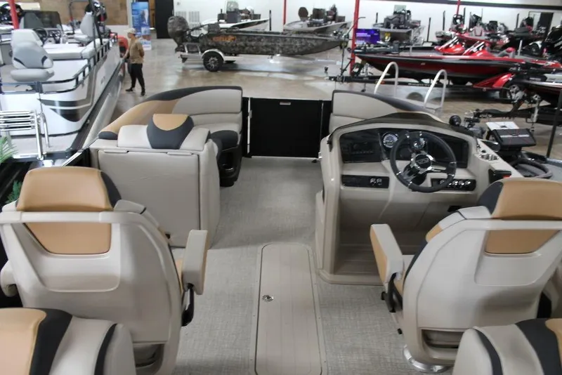 Slide: The Image of 2025 Avalon LSZ Quad Lounger 23 FT interior with luxurious seating and modern dashboard. - 8