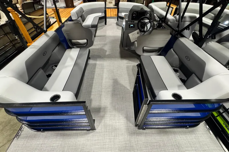 Slide: The Image of 2026 Veranda Vista View 20RC pontoon boat interior with gray seating and modern helm. - 11