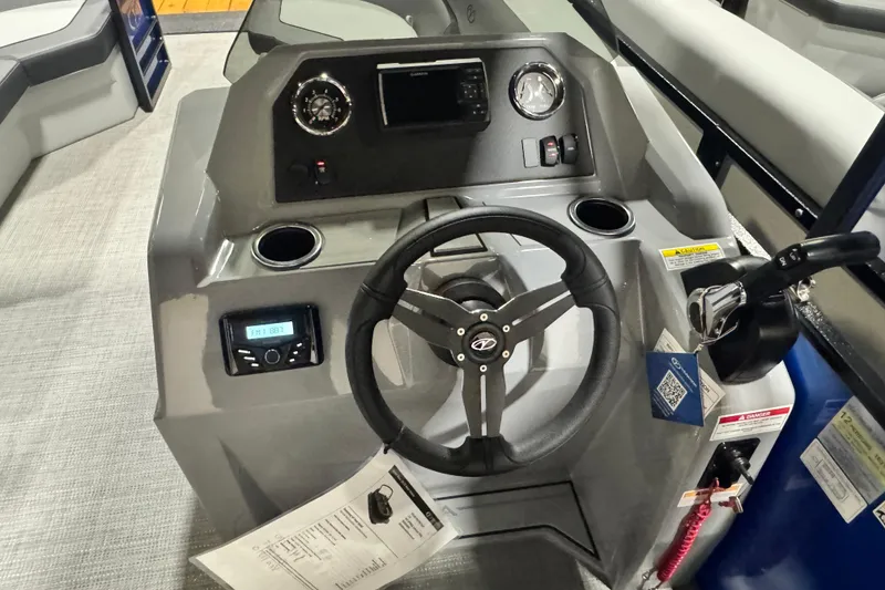 Slide: The Image of 2026 Veranda Vista View 20RC boat dashboard with steering wheel and controls. - 12