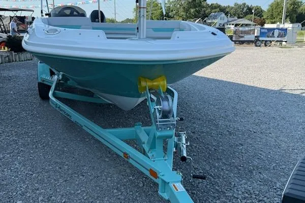 Slide: The Image of 2026 Hurricane SS185-OB boat on trailer, displayed outdoors on gravel. - 4