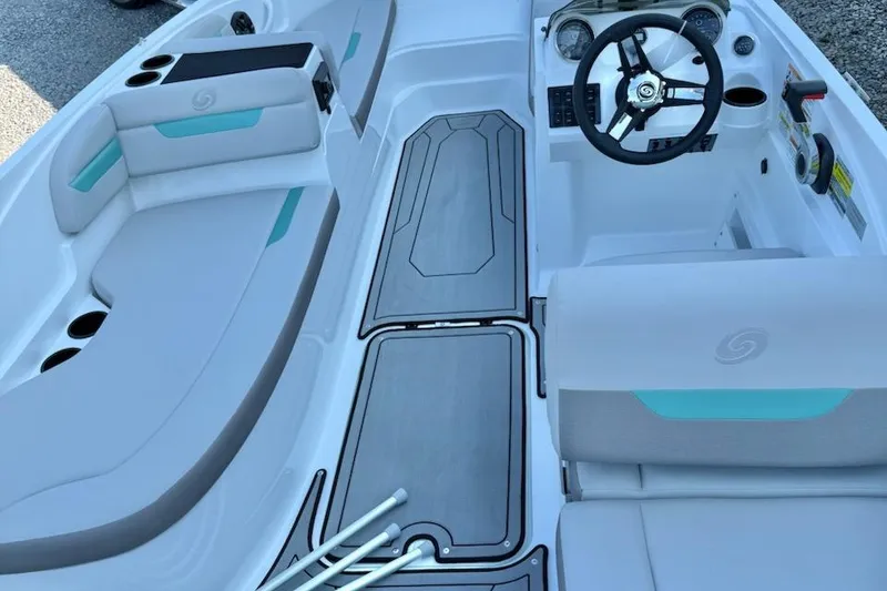 Slide: The Image of 2026 Hurricane SS185-OB boat interior with seating, steering wheel, and cup holders. - 5