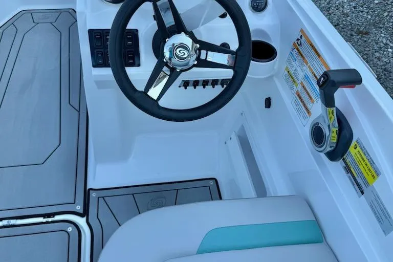 Slide: The Image of 2026 Hurricane SS185-OB boat cockpit with steering wheel and controls. - 9