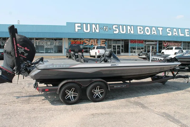 Slide: The Image of 2025 Skeeter ZXR21 boat at Fun-N-Sun Boat Sales dealership. - 1