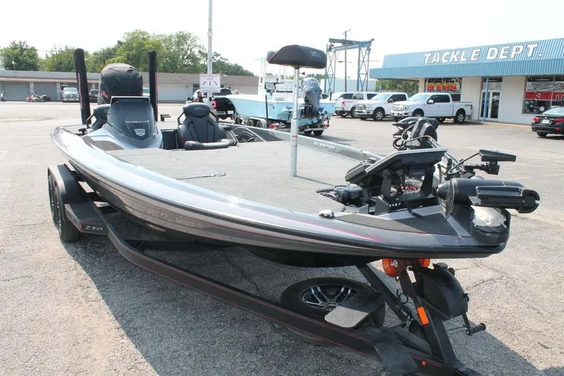Slide: The Image of 2025 Skeeter ZXR21 boat in parking lot, near tackle department store. - 3