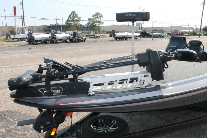 Slide: The Image of 2025 Skeeter ZXR21 boat with Minn Kota Ultrex trolling motor in a parking lot. - 5