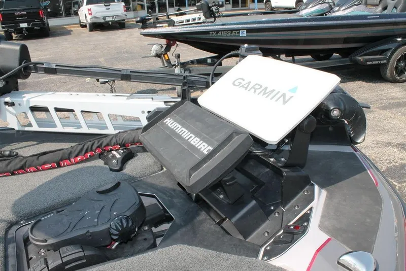 Slide: The Image of 2025 Skeeter ZXR21 boat with Garmin and Humminbird electronics on deck. - 7