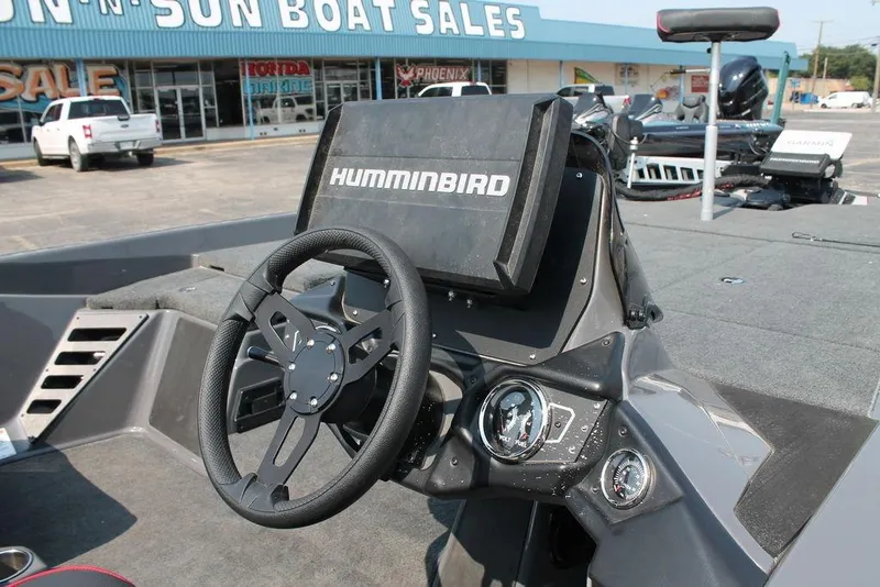 Slide: The Image of 2025 Skeeter ZXR21 boat dashboard with Humminbird navigation system. - 9
