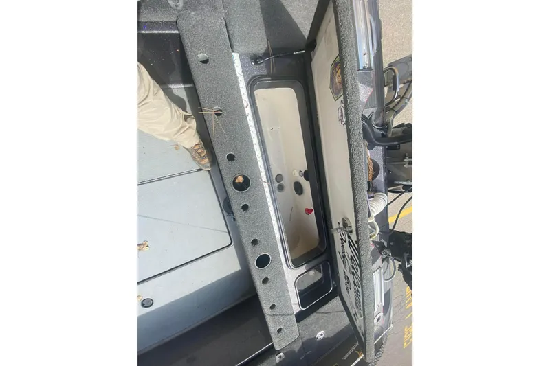 Slide: The Image of 2017 Ranger 621FS Fisherman boat interior with open storage compartment. - 10