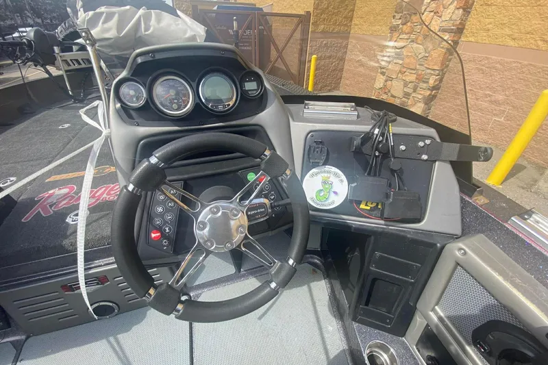 Slide: The Image of 2017 Ranger 621FS Fisherman boat dashboard with steering wheel and instrument panel. - 18