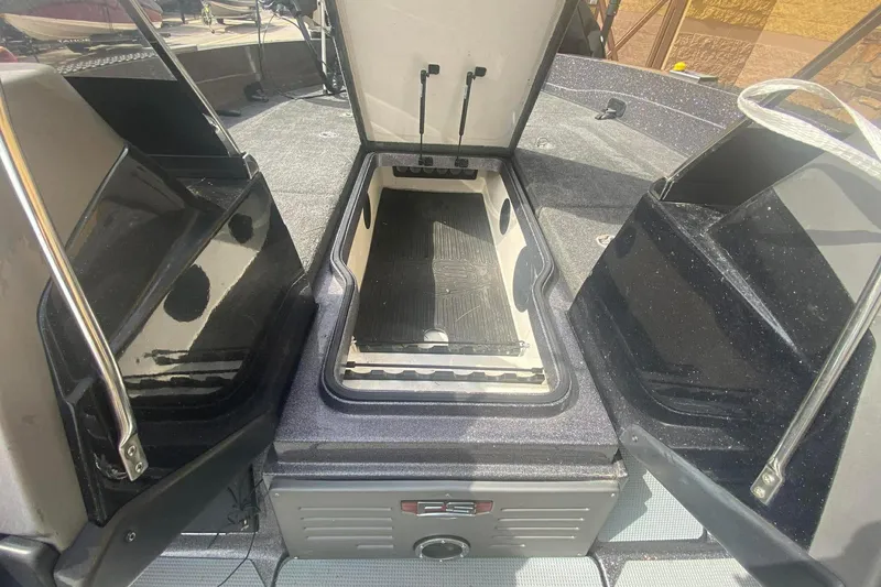 Slide: The Image of 2017 Ranger 621FS Fisherman boat interior storage compartment open. - 20