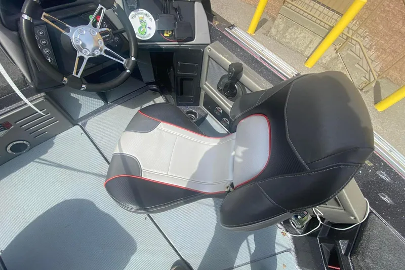 Slide: The Image of 2017 Ranger 621FS Fisherman boat interior with steering wheel and cushioned seat. - 25