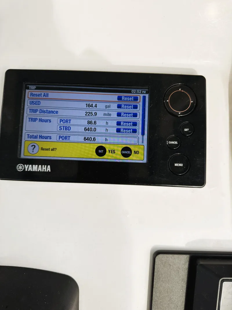 Slide: The Image of Yamaha display on 2016 Cobia 296 Center Console showing fuel and trip data. - 22