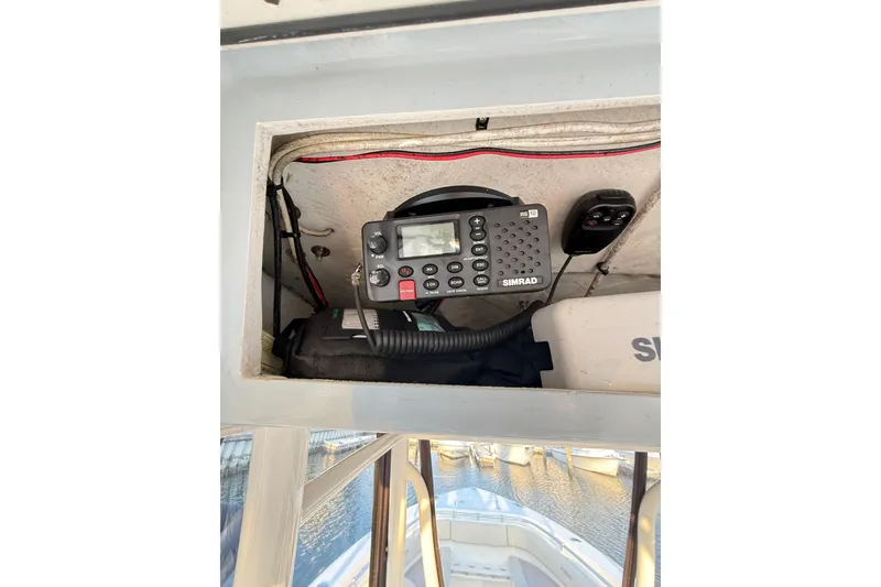 Slide: The Image of 2016 Cobia 296 Center Console with Simrad marine radio equipment. - 34