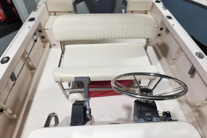 Slide: The Image of 1999 Grady-White Sportsman 180 boat interior with steering wheel and seating. - 10