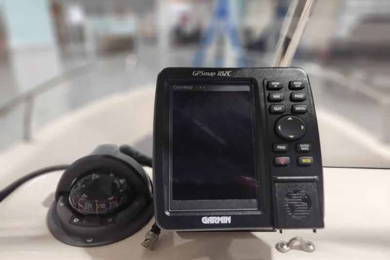 Slide: The Image of Garmin GPSmap 182C on 1999 Grady-White Sportsman 180 boat dashboard. - 13