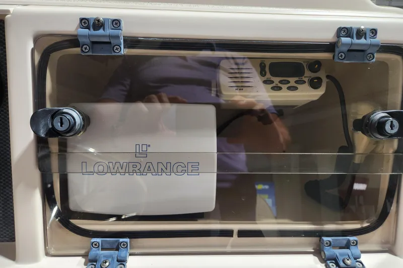 Slide: The Image of Lowrance marine electronics on 1999 Grady-White Sportsman 180 boat dashboard. - 14