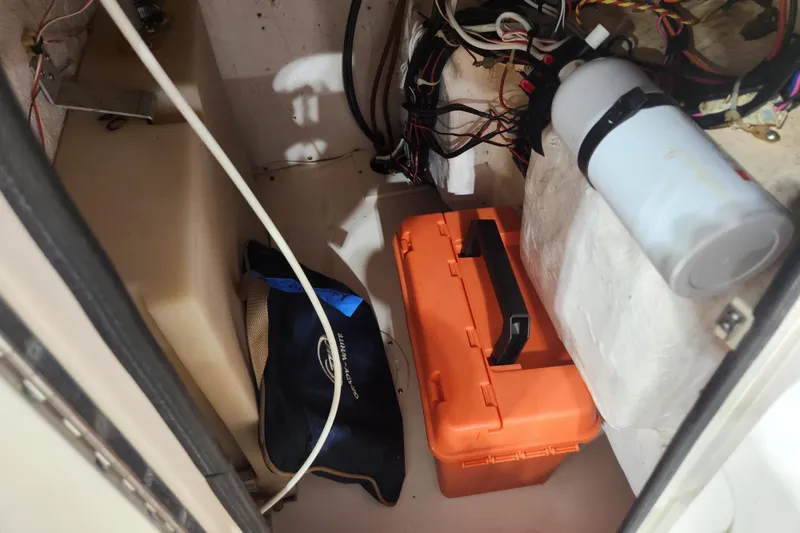 Slide: The Image of Interior of 1999 Grady-White Sportsman 180 boat with storage and wiring. - 15