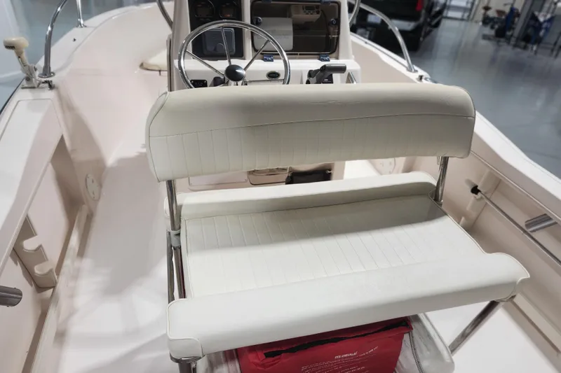 Slide: The Image of 1999 Grady-White Sportsman 180 boat interior with steering wheel and seating. - 16