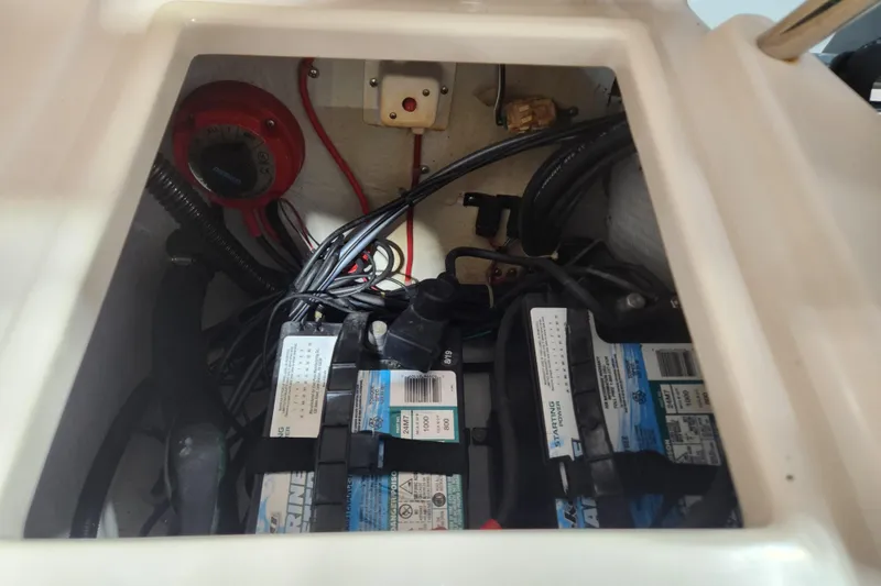 Slide: The Image of Battery compartment of 1999 Grady-White Sportsman 180 boat with wiring and components. - 17