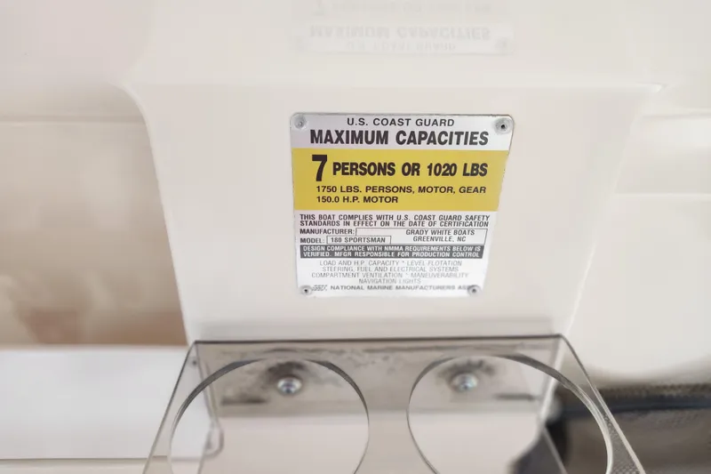 Slide: The Image of Capacity label on 1999 Grady-White Sportsman 180, limits 7 people or 1020 lbs. - 18