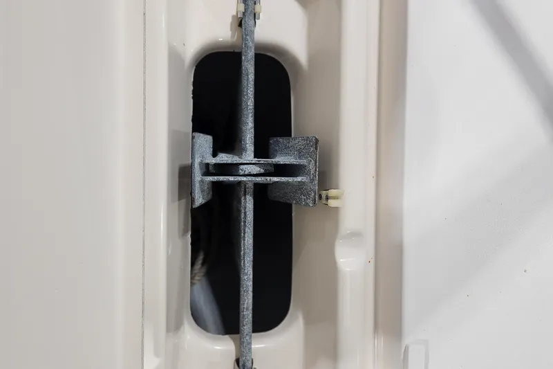 Slide: The Image of Close-up of a 1999 Grady-White Sportsman 180 boat component, showcasing metal hardware. - 19