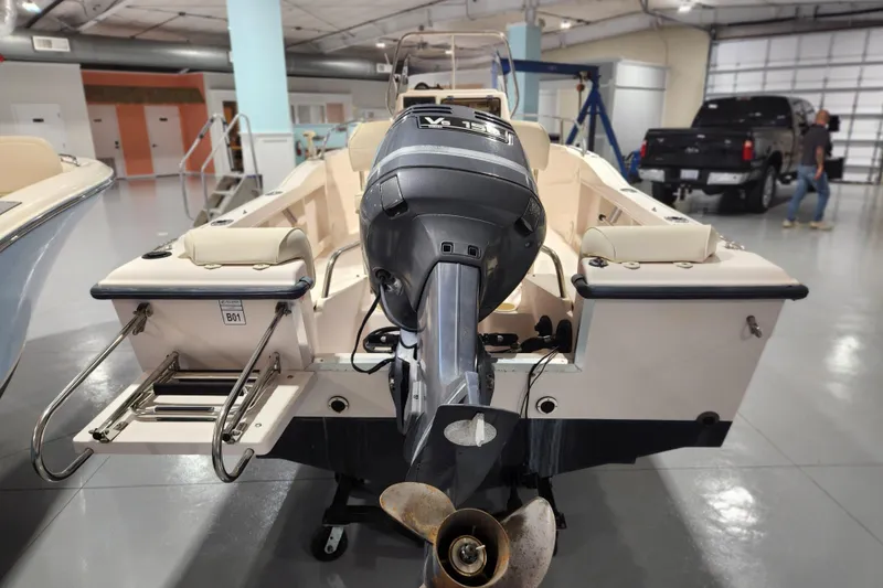 Slide: The Image of 1999 Grady-White Sportsman 180 boat with outboard motor in showroom. - 3