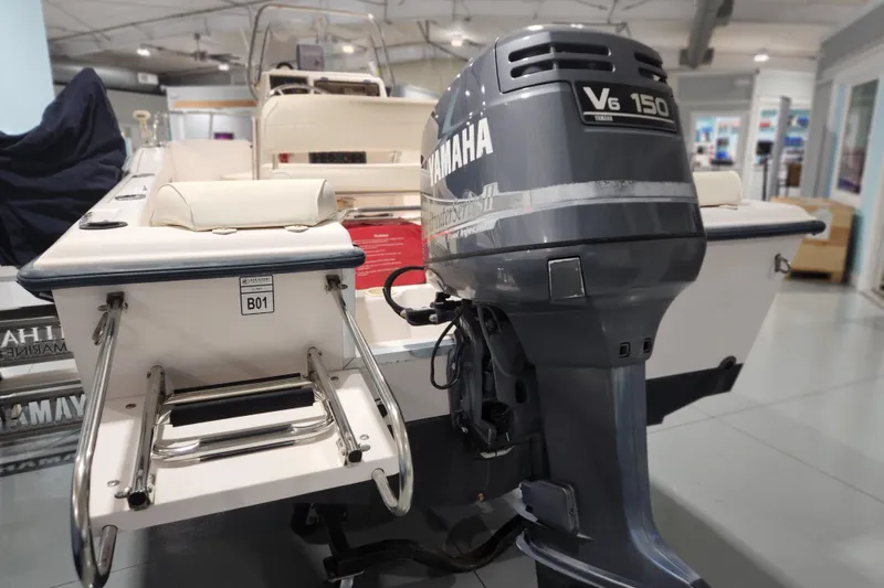Slide: The Image of 1999 Grady-White Sportsman 180 with Yamaha V6 150 outboard motor in showroom. - 4