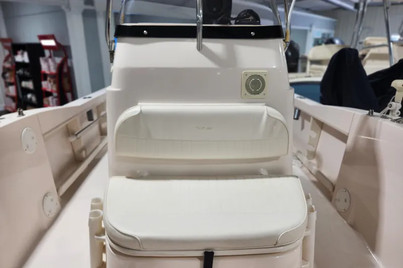 Slide: The Image of 1999 Grady-White Sportsman 180 boat interior with seating and console view. - 7