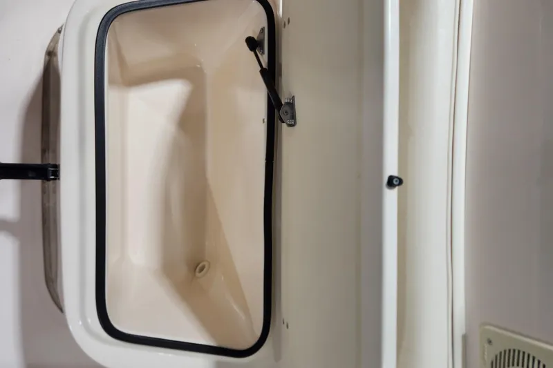 Slide: The Image of Open storage compartment on 1999 Grady-White Sportsman 180 boat. - 8