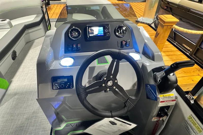 Slide: The Image of Control panel of 2026 Veranda Vista View Sport VS22RC boat with steering wheel and dashboard. - 7