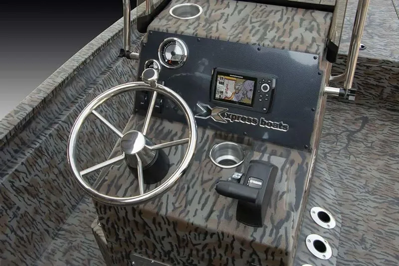 Slide: The Image of 2026 Xpress H190B boat dashboard with steering wheel and navigation system. - 6