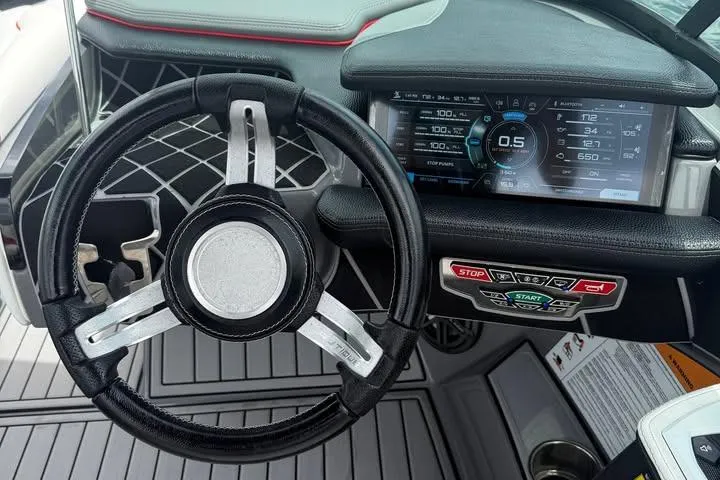 Slide: The Image of Steering wheel and dashboard of 2018 Nautique Super Air Nautique GS22 boat. - 12