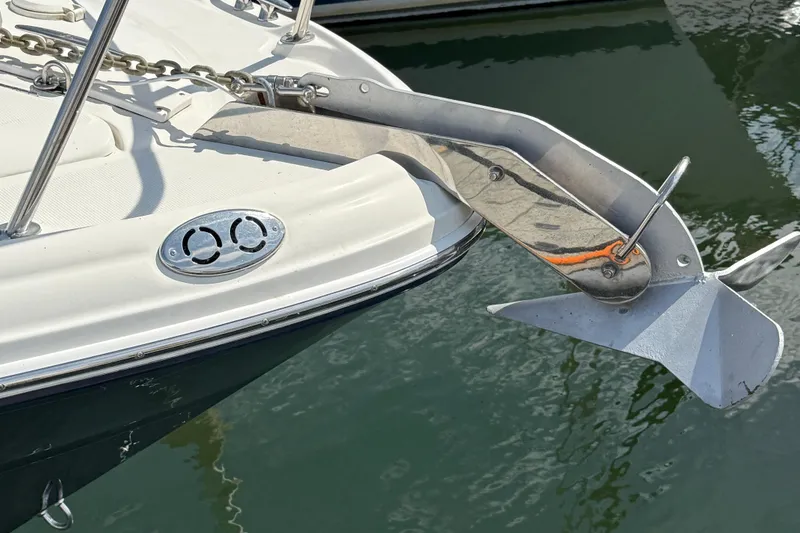 Slide: The Image of Bow of 2005 Sea Ray 300 Sundancer with anchor over water. - 27