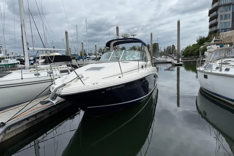Slide: The Image of 2005 Sea Ray 300 Sundancer docked at marina under cloudy sky. - 39