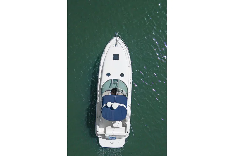 Slide: The Image of Aerial view of 2005 Sea Ray 300 Sundancer yacht on green water. - 44