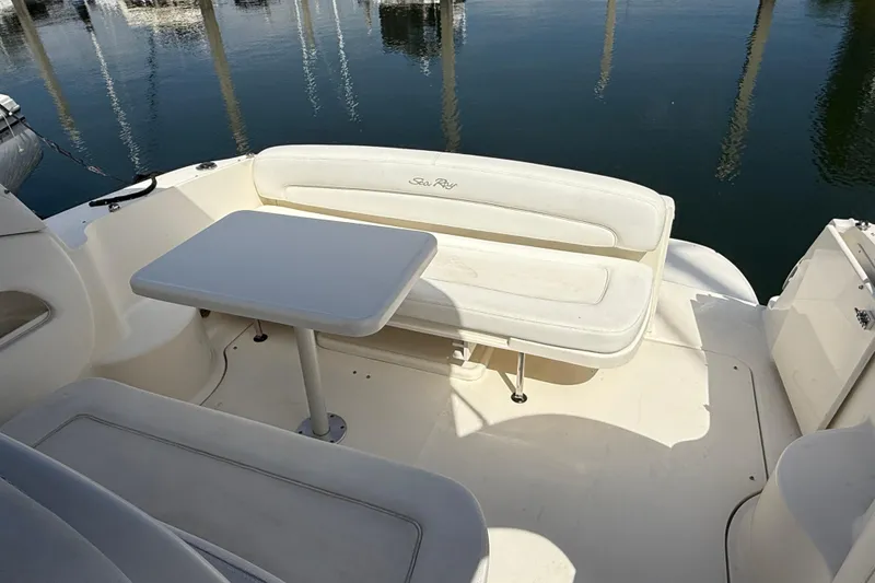 Slide: The Image of 2005 Sea Ray 300 Sundancer boat interior with seating and table. - 7